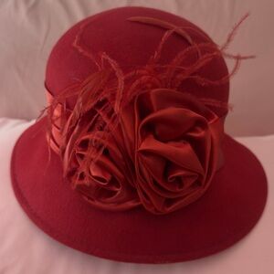 Elegant Red Felt Cloche Hat with Satin Rosette and Feather Trim
